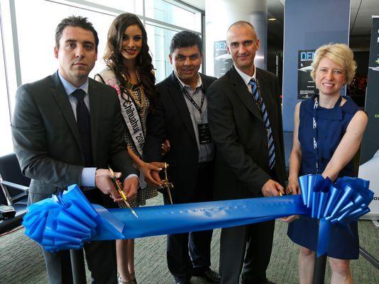 1405200627000-ribbon-cutting---Volaris-CUU