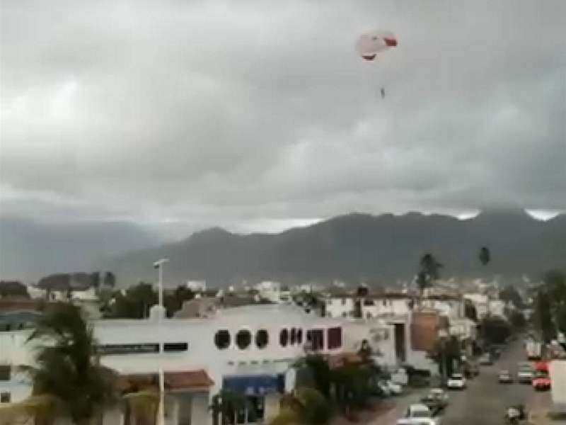 Parachuting Tourist Lands on Power Lines