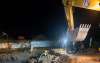 SEAPAL crews repair a large water pipeline in an excavated work area at night in Puerto Vallarta.