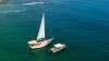 The classic sailboat Ada and the powerboat Bruna together on the blue waters of Banderas Bay.